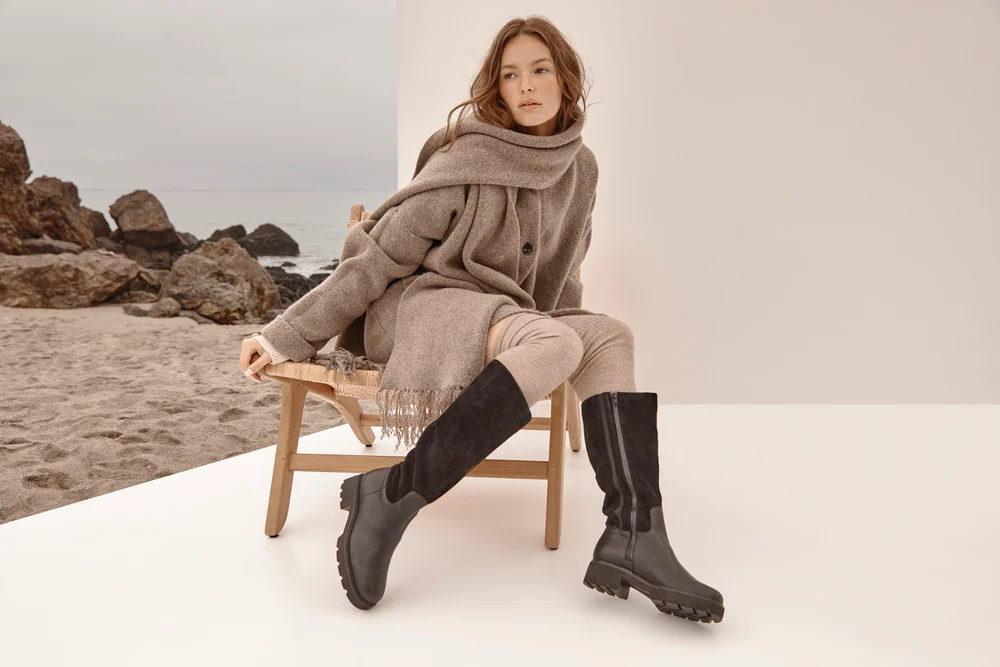 Wie man kniehohe Stiefel stilvoll trägt und kombiniert